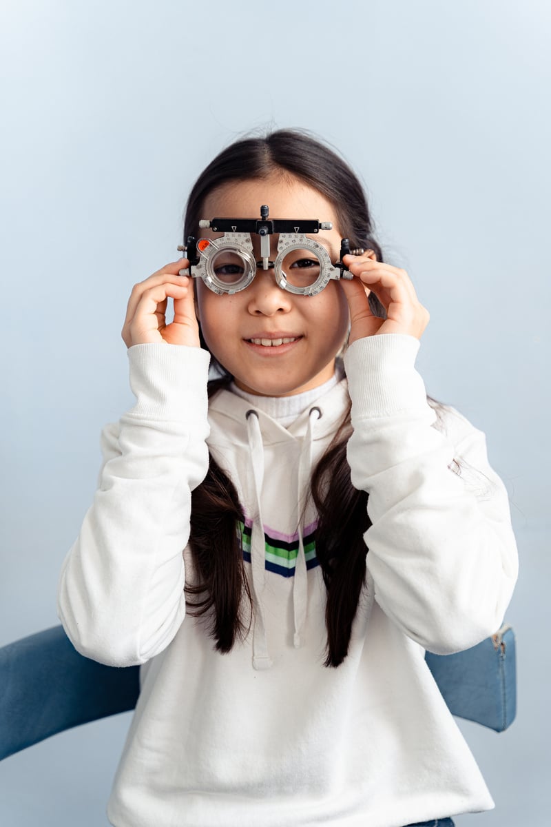 A Girl Wearing Metal Framed Glasses